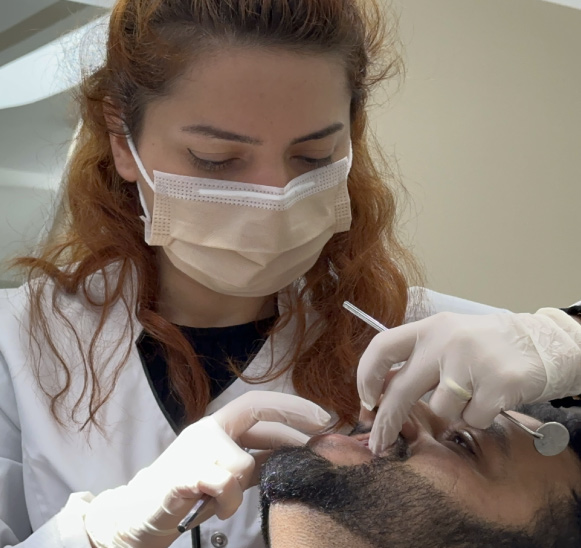 Dentist giving a dental treatment